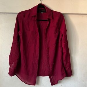 It’s a girl size medium blouse. It’s burgundy